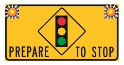 Signal lights ahead — prepare to stop when lights are flashing